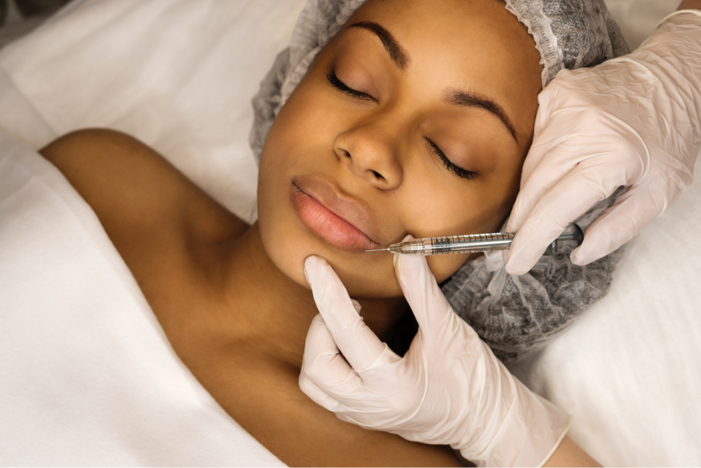 Woman getting lip fillers injection